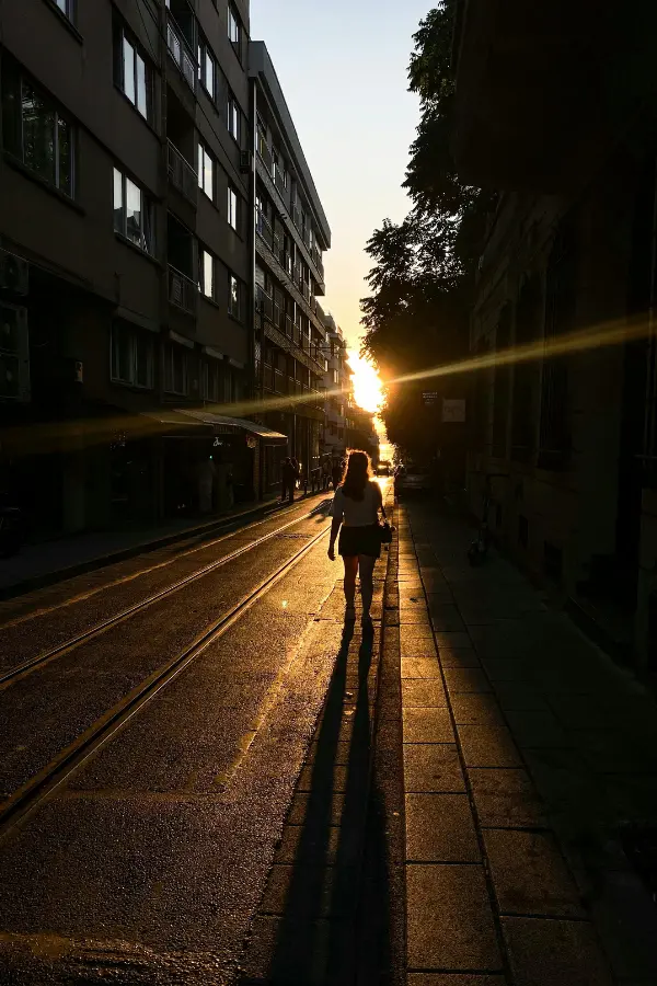 A woman walking during sunset