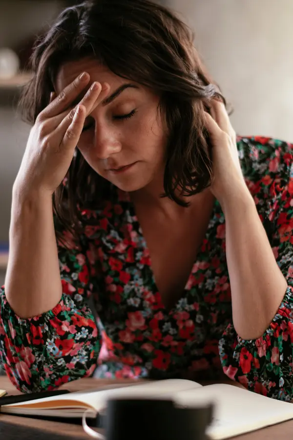 A tired, anxious woman