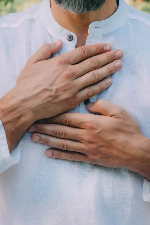 A person holding their chest